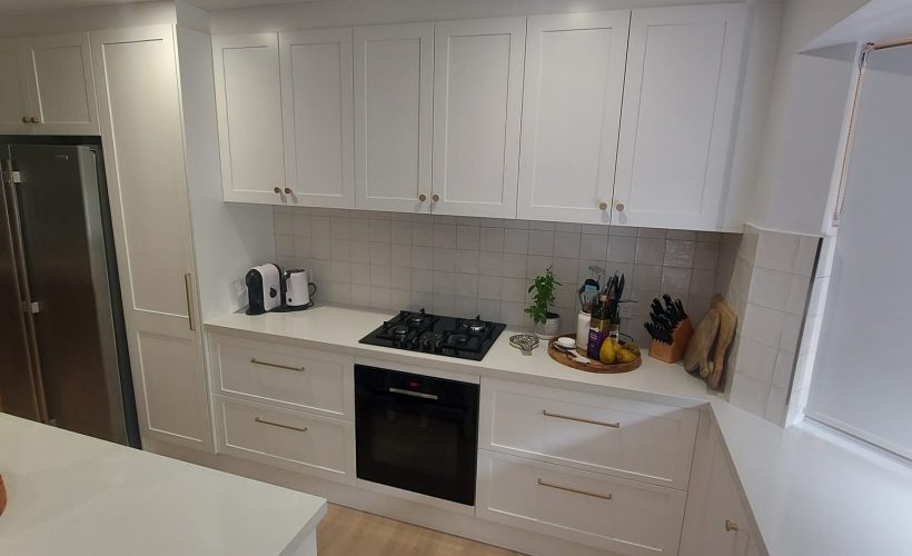 White galley kitchen with custom cabinetry